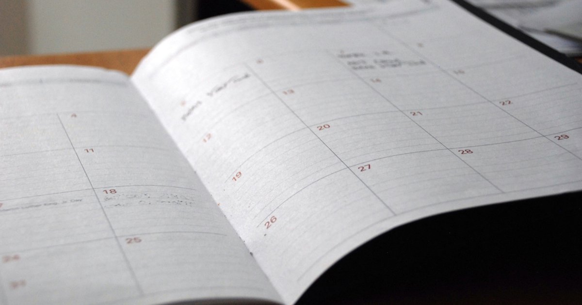 An open monthly planner on a desk
