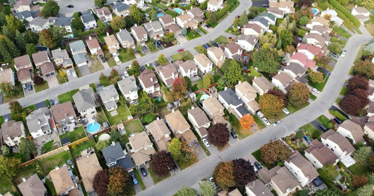 An aerial view of streets winding through a suburban neighbourhood